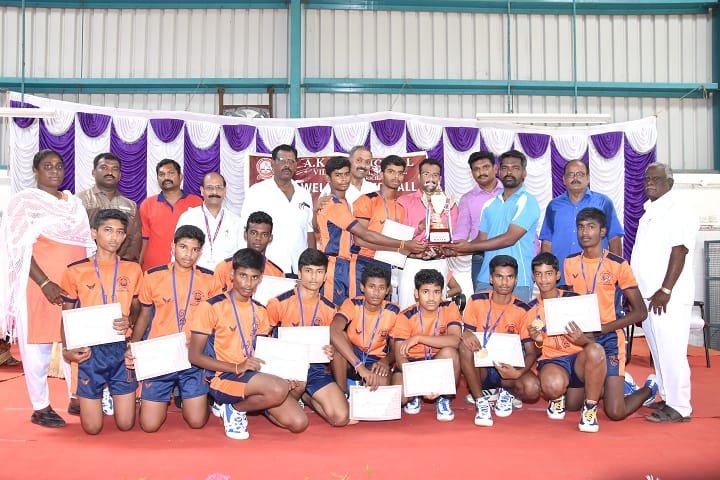 Volleyball team with trophy and certificates